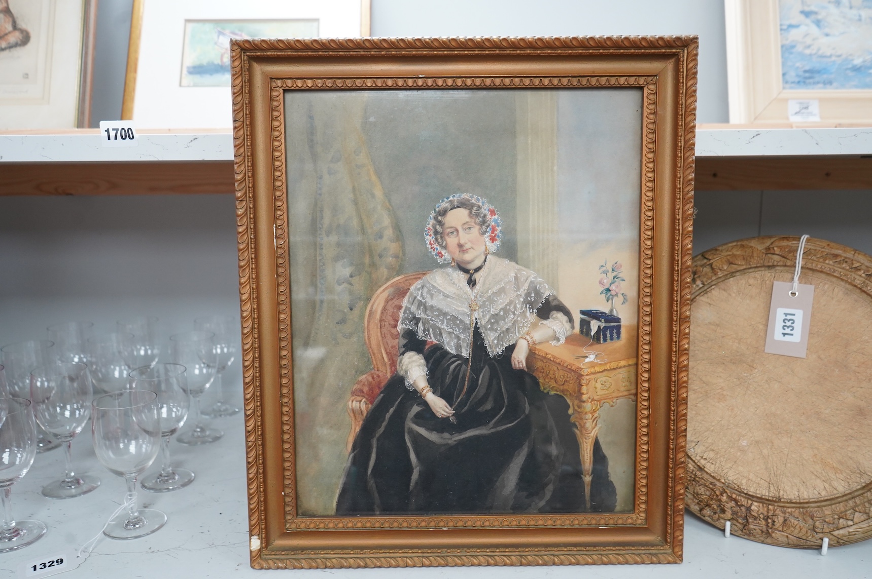 Mid Victorian School, Portrait of a seated lady in an interior, unsigned, watercolour, together with two other watercolours, portraits of women, largest 36 x 29cm